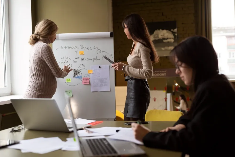 Brand strategy workshop with sticky notes on a whiteboard